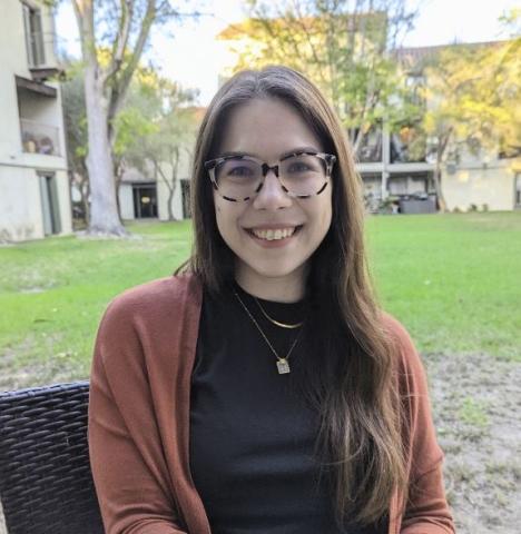 Women with brown hair and glasses